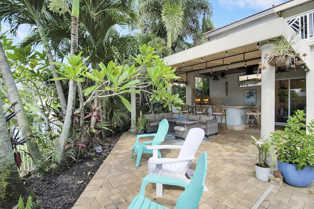 view of patio / terrace featuring ceiling fan and an outdoor hangout area