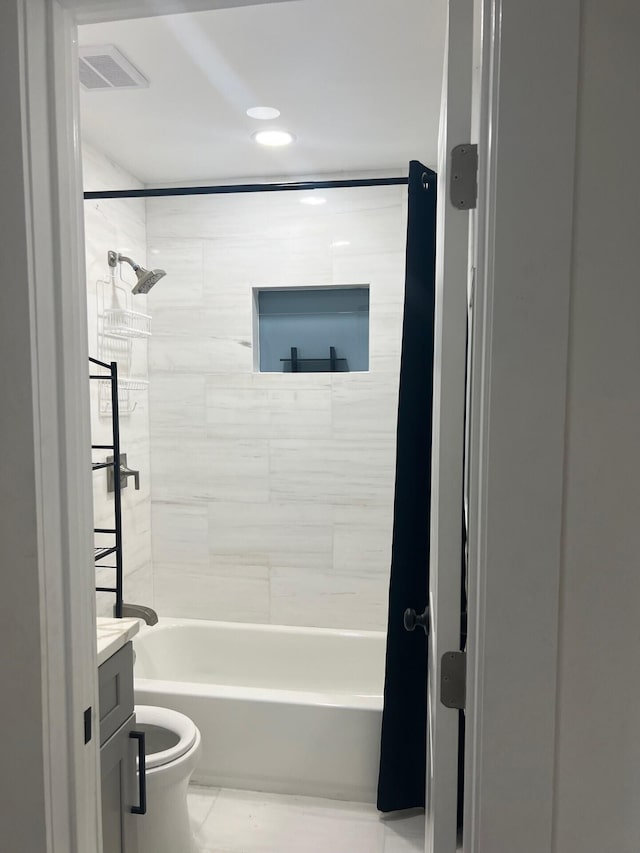 full bathroom with vanity, toilet, tile patterned floors, and tiled shower / bath