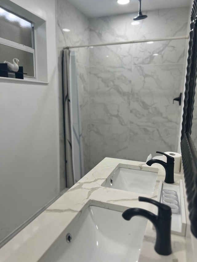 bathroom featuring vanity and walk in shower