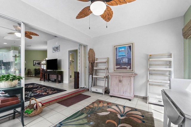 tiled living room featuring ceiling fan