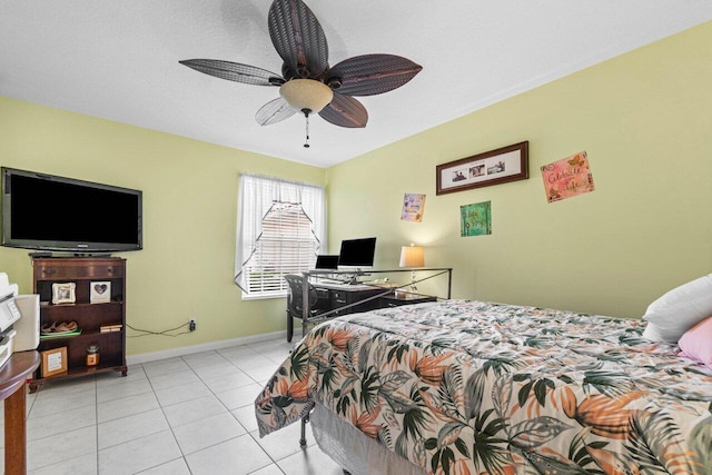 tiled bedroom featuring ceiling fan and a textured ceiling