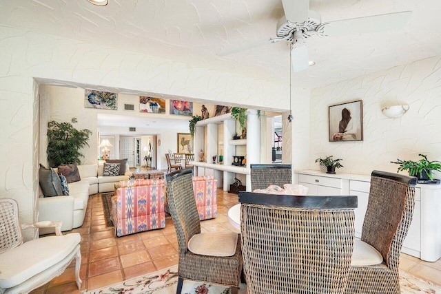 dining room with ceiling fan and light tile patterned flooring