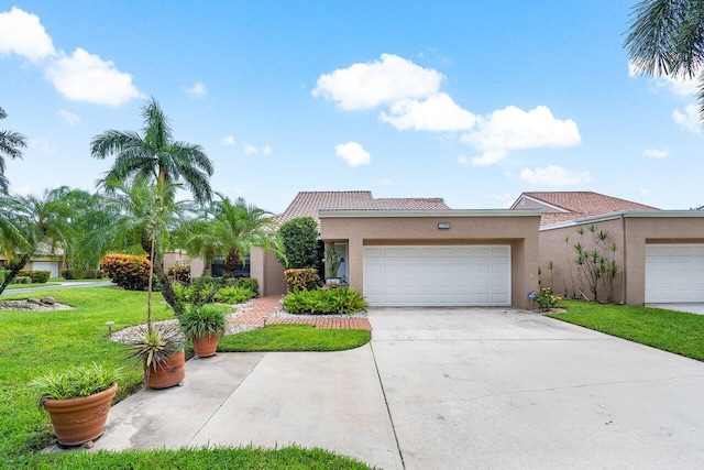 view of front of home featuring a garage and a front yard