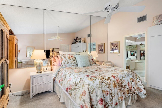 bedroom featuring ceiling fan, high vaulted ceiling, ensuite bathroom, light colored carpet, and a textured ceiling