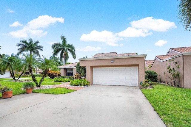 view of front of property featuring a garage and a front yard