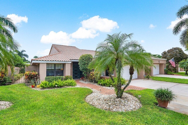 view of front of home featuring a front yard and a garage