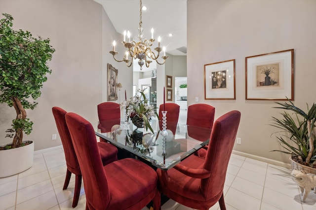 dining room with light tile patterned flooring, a chandelier, and high vaulted ceiling