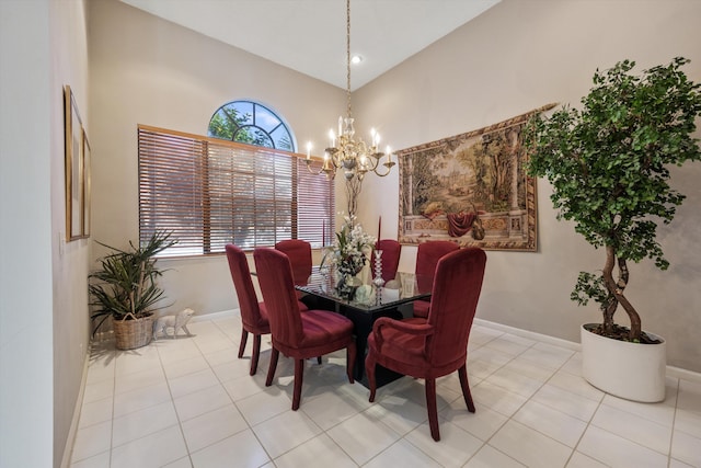 dining room featuring light tile patterned flooring, a chandelier, and high vaulted ceiling