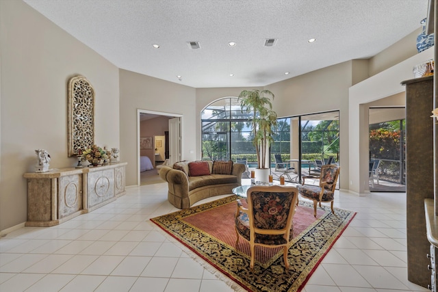 tiled living room with a textured ceiling