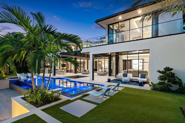 view of swimming pool with a patio, a yard, and outdoor lounge area