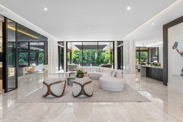 living room featuring floor to ceiling windows