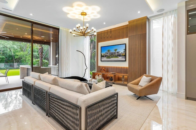 living room with a notable chandelier, a wall of windows, and wood walls