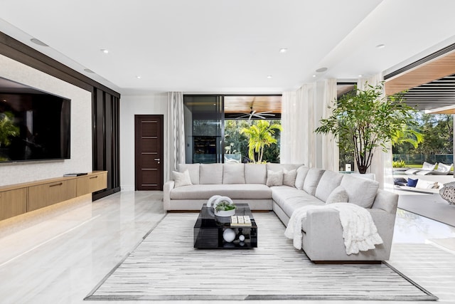 living room featuring expansive windows and a wealth of natural light