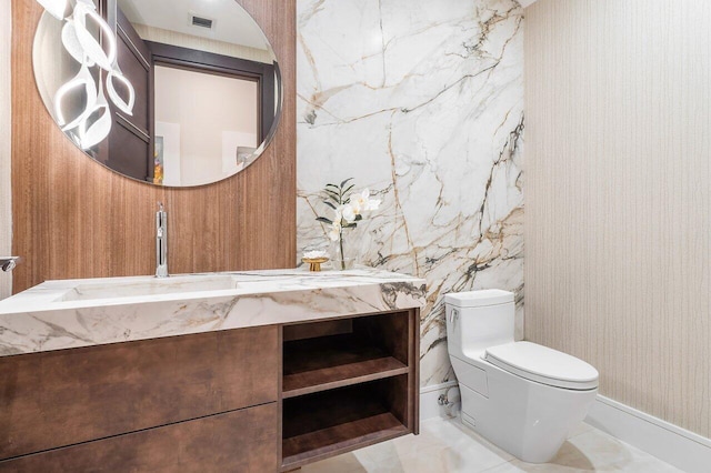 bathroom with vanity and toilet