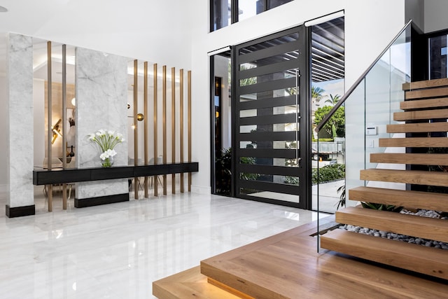 entrance foyer featuring a towering ceiling