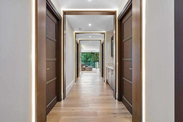 corridor featuring light hardwood / wood-style floors