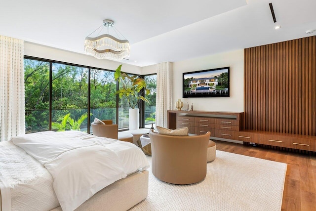 bedroom featuring multiple windows and wood-type flooring