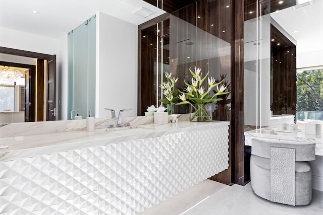 bathroom featuring walk in shower and vanity