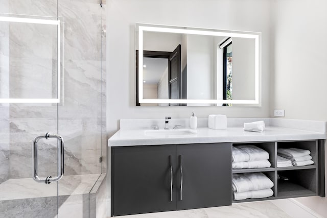 bathroom featuring vanity and an enclosed shower