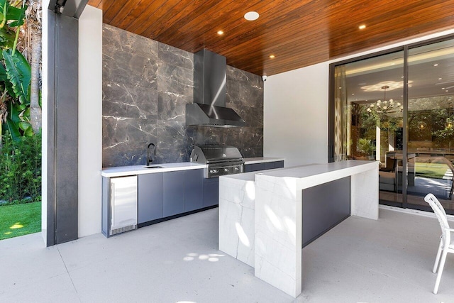 view of patio / terrace featuring an outdoor kitchen, grilling area, and sink