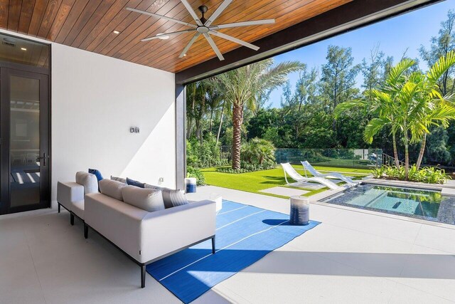 view of patio featuring an outdoor living space and ceiling fan