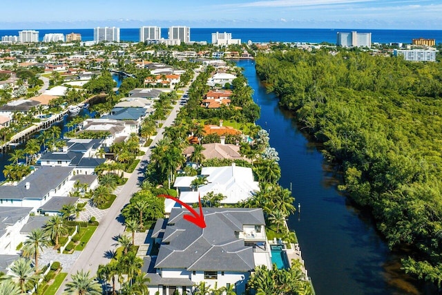 birds eye view of property featuring a water view