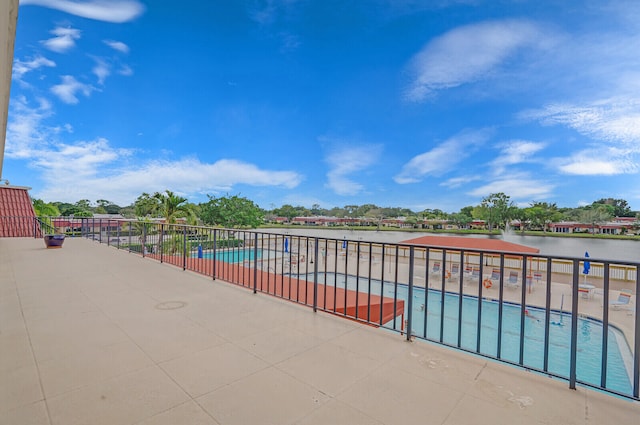 view of pool with a water view