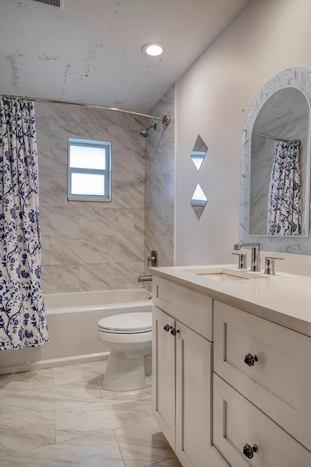 full bathroom with vanity, toilet, and shower / bath combo with shower curtain