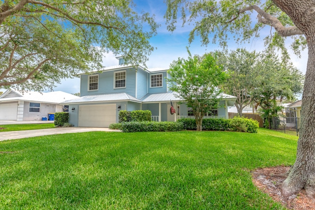 view of front of property with a front yard and a garage