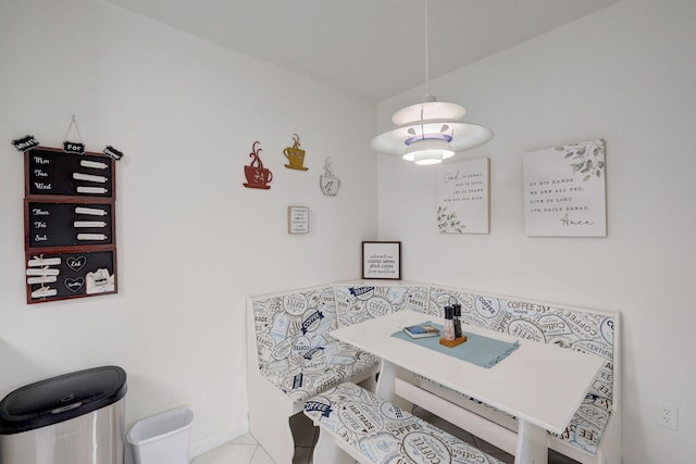 dining space featuring light tile patterned flooring