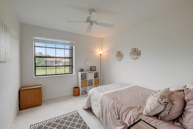 tiled bedroom with ceiling fan