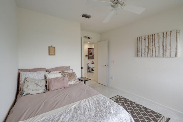 tiled bedroom with ceiling fan