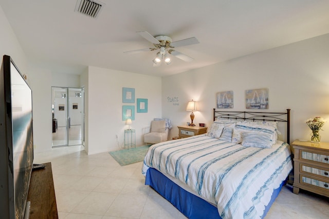 tiled bedroom featuring ceiling fan