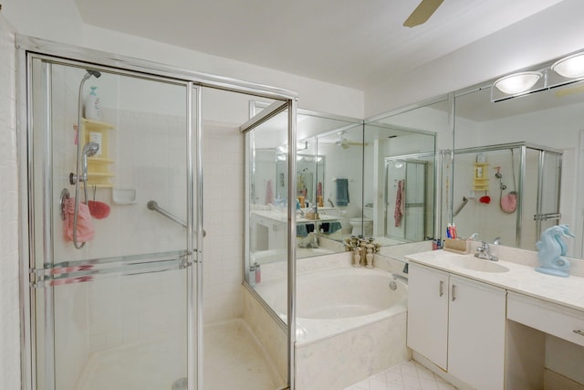 full bathroom with vanity, ceiling fan, plus walk in shower, and toilet