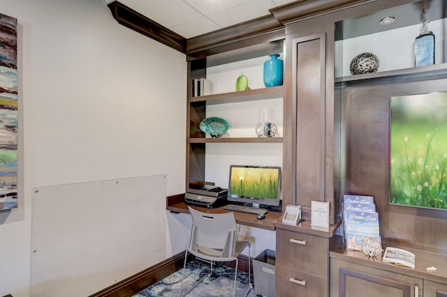 office area featuring crown molding and built in features