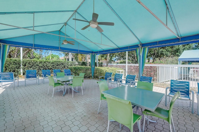 view of patio / terrace featuring a gazebo and ceiling fan