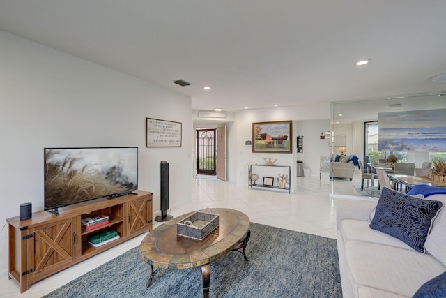 tiled living room featuring a healthy amount of sunlight