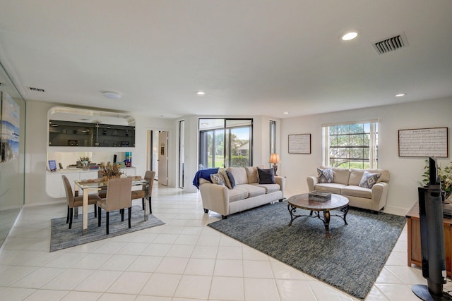 tiled living room featuring plenty of natural light