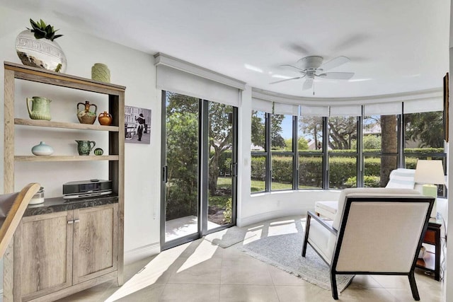 sunroom / solarium with ceiling fan and a wealth of natural light