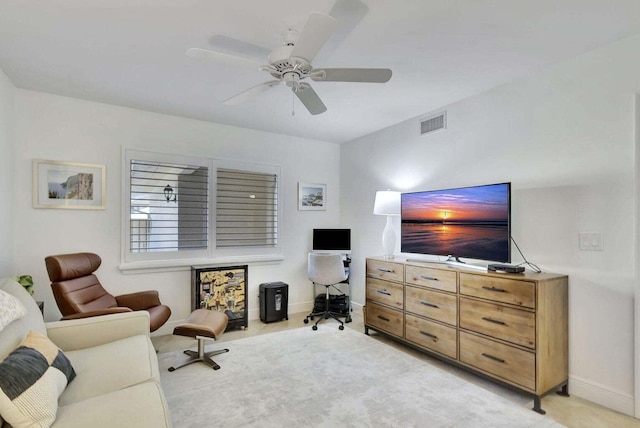 living room with light carpet and ceiling fan