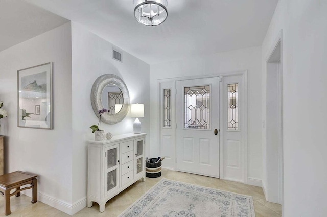 entryway featuring light tile patterned flooring