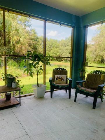 sunroom with plenty of natural light