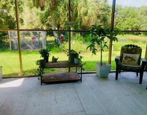 view of home's community featuring a patio area and a lawn