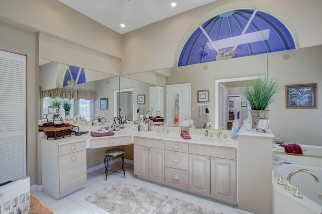 bathroom featuring vanity, tile patterned floors, and a bathing tub