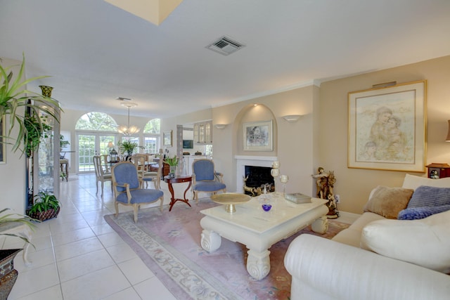 tiled living room featuring an inviting chandelier