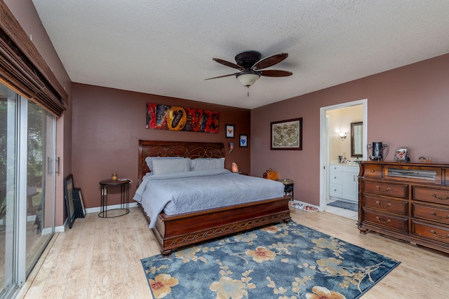 bedroom with ceiling fan, access to outside, a textured ceiling, light hardwood / wood-style flooring, and ensuite bath