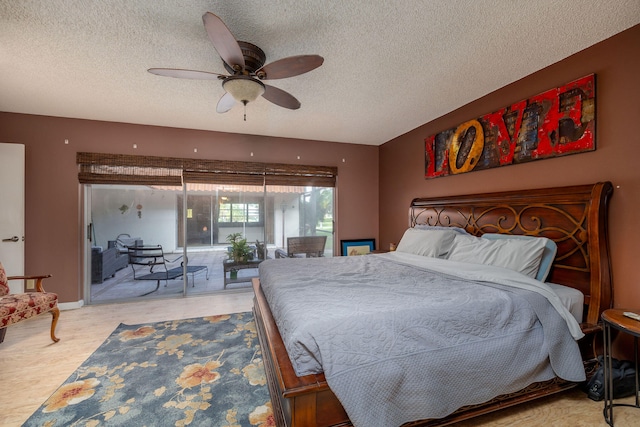 bedroom with a textured ceiling, access to outside, and ceiling fan