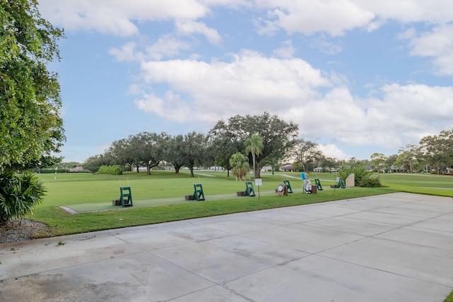 view of property's community featuring a yard