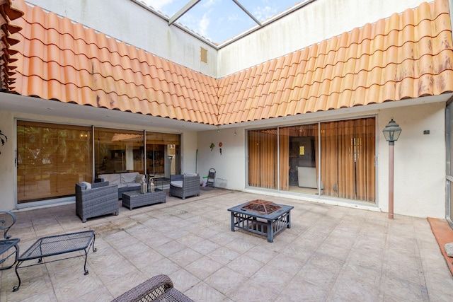 view of patio / terrace featuring an outdoor living space with a fire pit