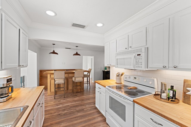 kitchen with white cabinets, decorative light fixtures, white appliances, and wood counters